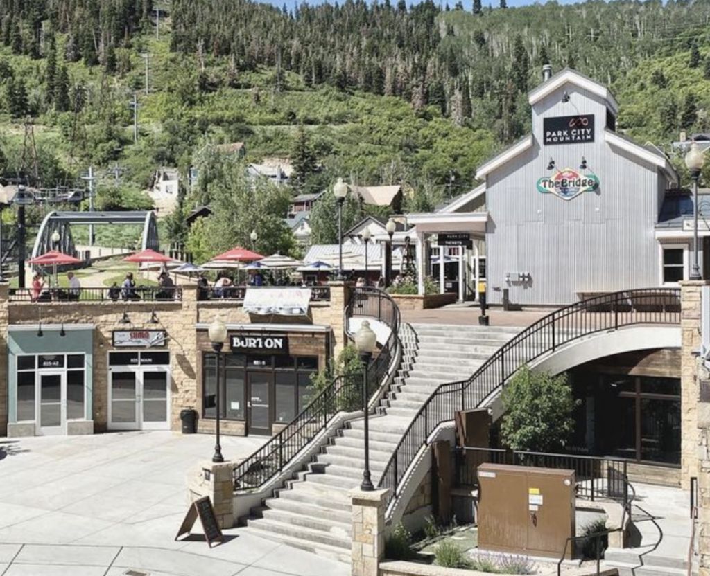 A large staircase leading up to The Bridge restaurant in Park City, Utah set against the mountainside.
