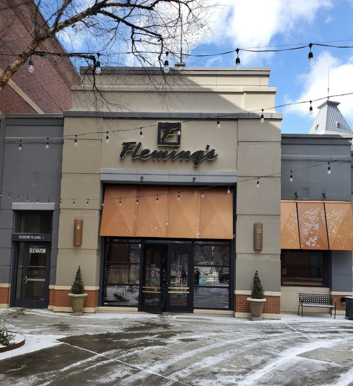 A snow covered facade of Flemings, one of the best steakhouses in Salt Lake City.